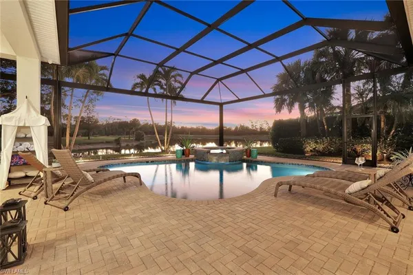 a view of a swimming pool with sitting area