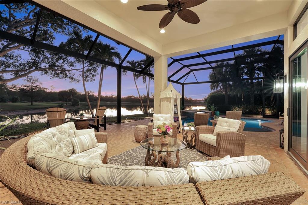 5092 Cerromar Drive Naples, FL 34112 - Photo 12 of 47 a living room with furniture and a large window