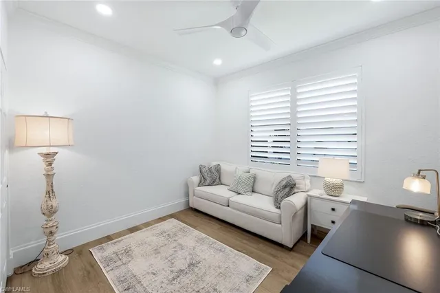 a bedroom with a large bed and a flat screen tv