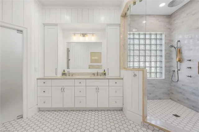 a white bath tub sitting in a bathroom