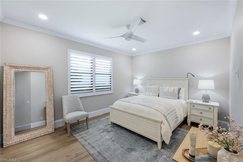 5092 Cerromar Drive Naples, FL 34112 - Photo 27 of 47 a bedroom with a bed and a window