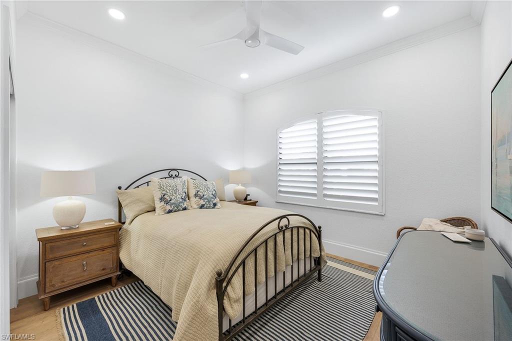 5092 Cerromar Drive Naples, FL 34112 - Photo 29 of 47 a bedroom with a bed and a window