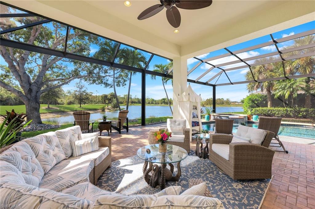 5092 Cerromar Drive Naples, FL 34112 - Photo 35 of 47 a living room with furniture and a large window