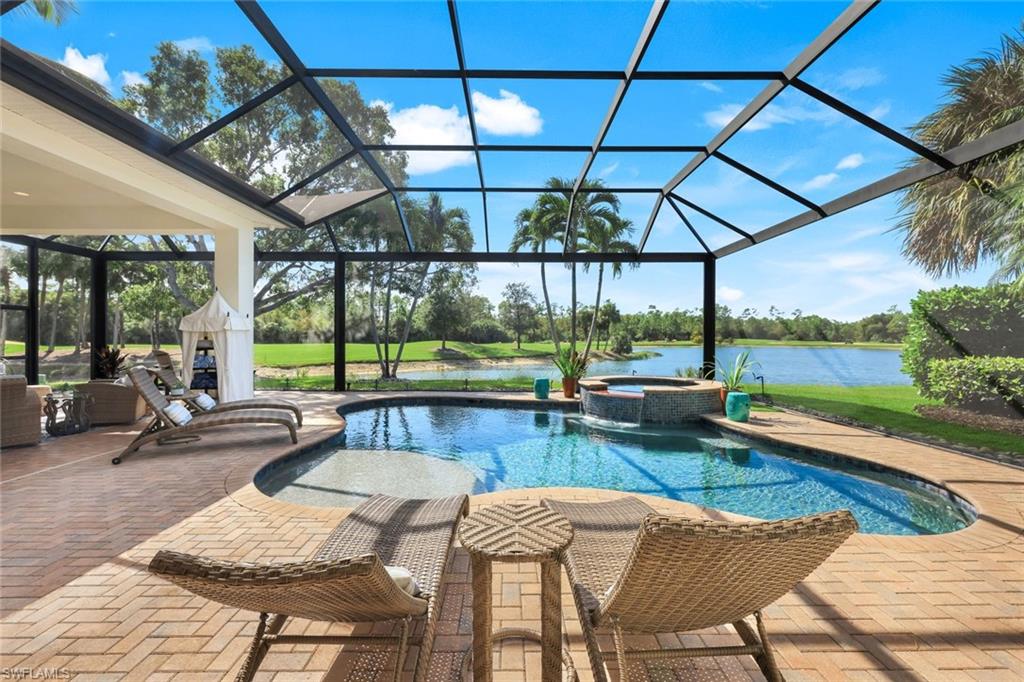 5092 Cerromar Drive Naples, FL 34112 - Photo 37 of 47 a view of a patio with swimming pool
