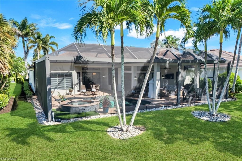 5092 Cerromar Drive Naples, FL 34112 - Photo 40 of 47 a front view of a house with garden