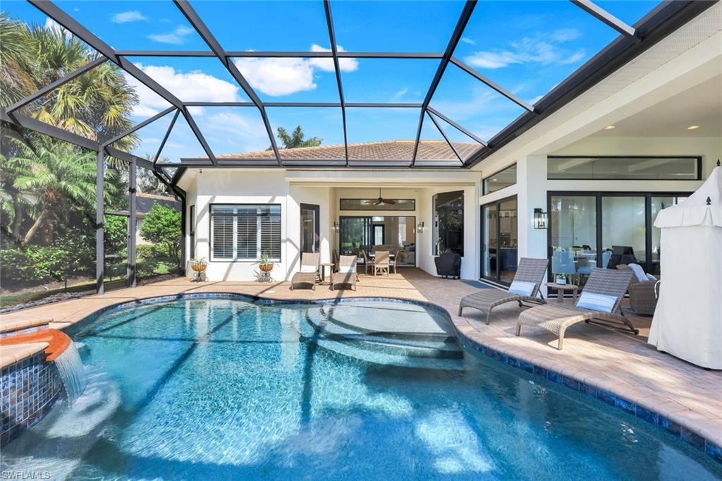 5092 Cerromar Drive Naples, FL 34112 - Photo 42 of 47 a view of swimming pool with outdoor seating