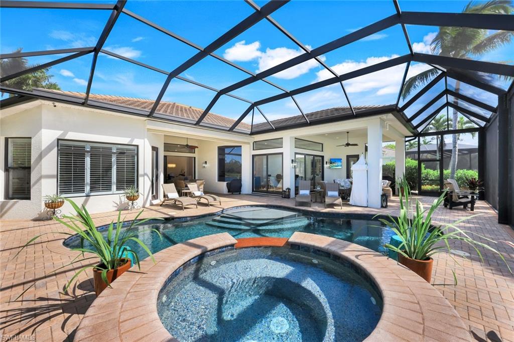 5092 Cerromar Drive Naples, FL 34112 - Photo 43 of 47 a view of a house with swimming pool and sitting area