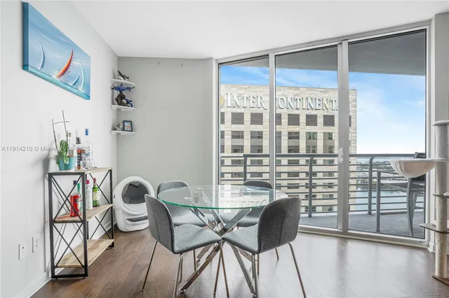 a view of a dining room with furniture and a window