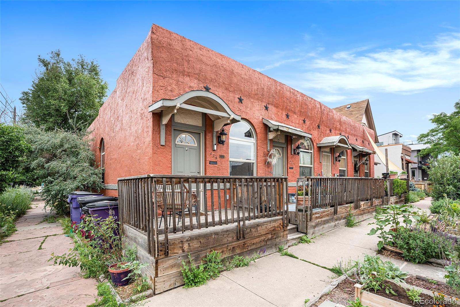 474 Inca Street Denver, CO 80204 - Photo 2 of 15 a front view of a house with a garden