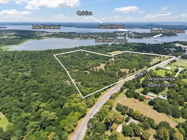 a view of a swimming pool and an outdoor seating