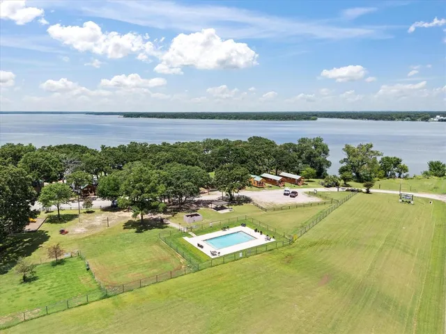 a view of a lake with a yard