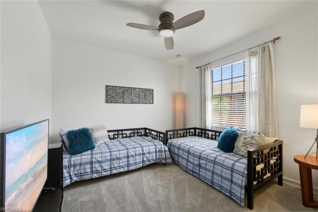 9140 Delano Street, Unit 9302 Naples, FL 34113 - Photo 28 of 40 a living room with furniture and a window