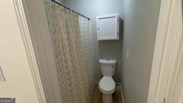 a bathroom with a sink and toilet