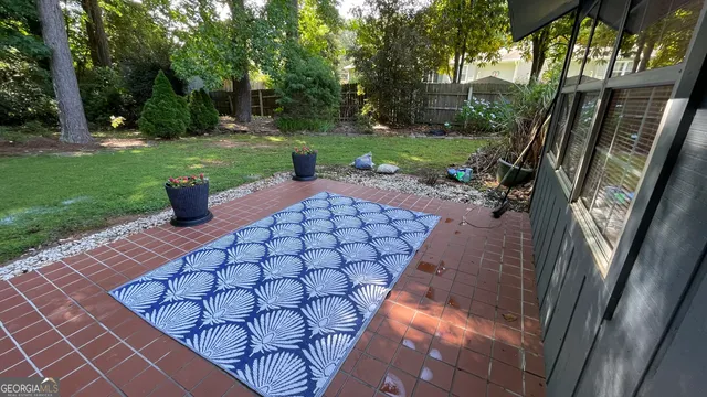 a garden with flowers in front of it