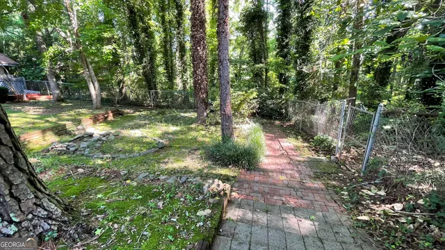 a backyard of a house with lots of green space