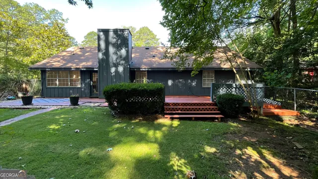 a view of a house with a yard porch and sitting area