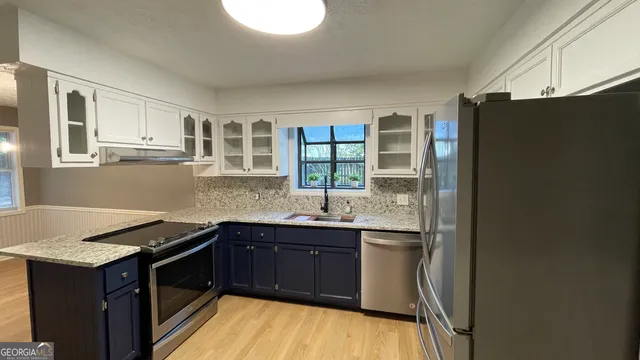 a kitchen with a sink and cabinets