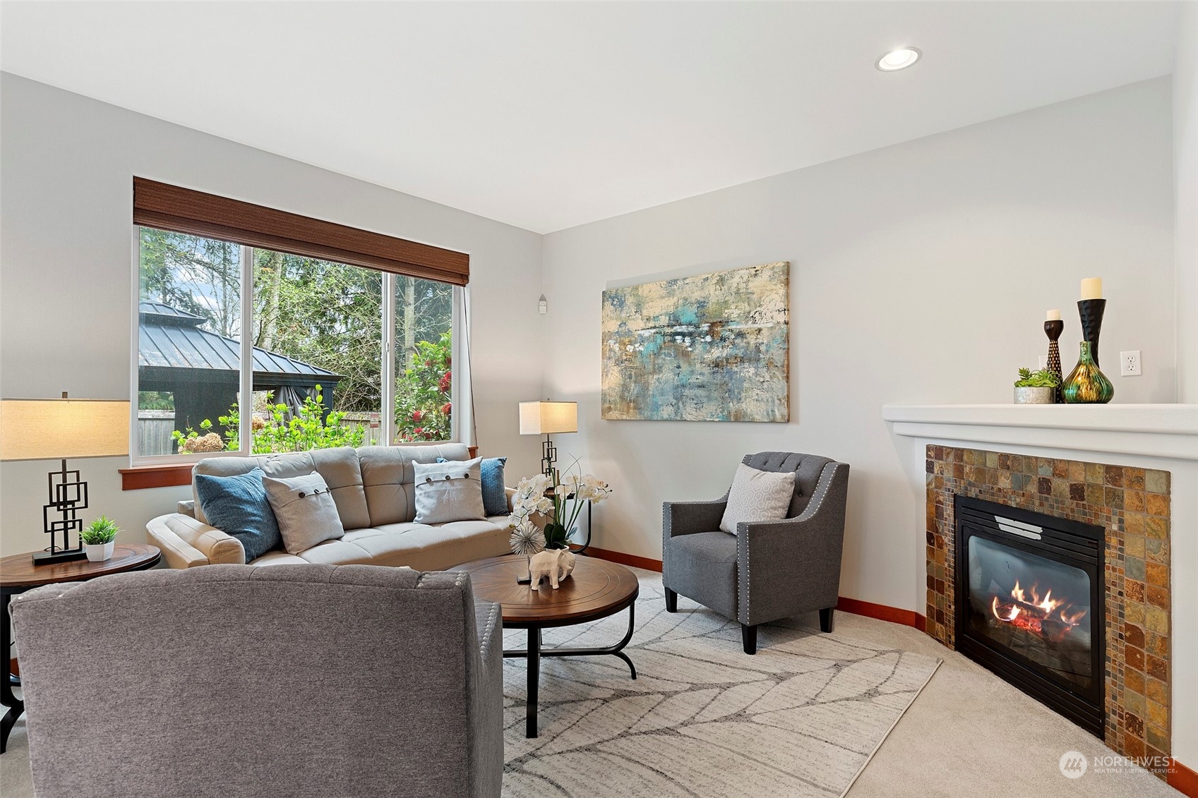4518 147th Place Southeast Bothell, WA 98012 - Photo 16 of 36 a living room with furniture and a fireplace