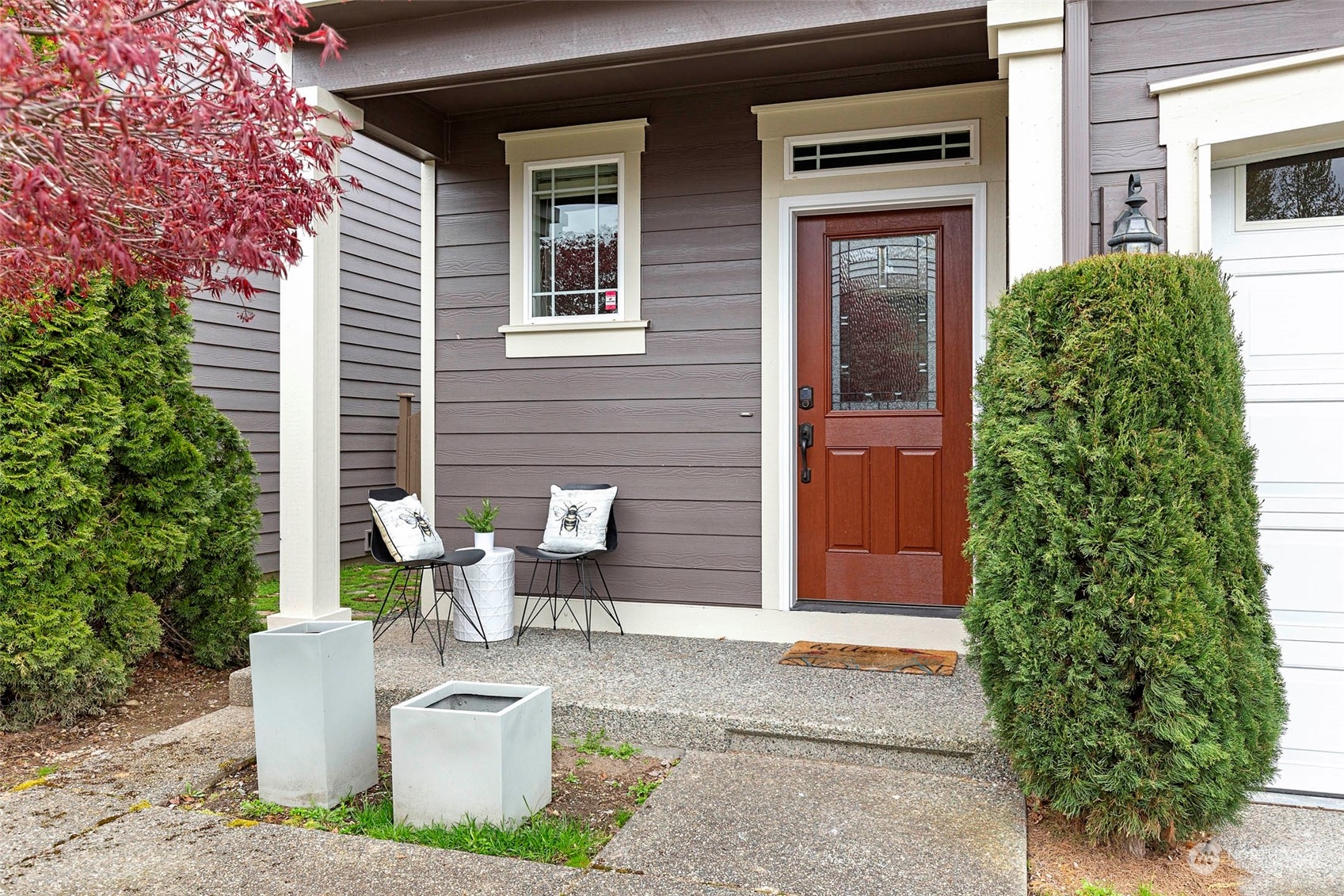 4518 147th Place Southeast Bothell, WA 98012 - Photo 2 of 36 a view of a brick house with potted plants