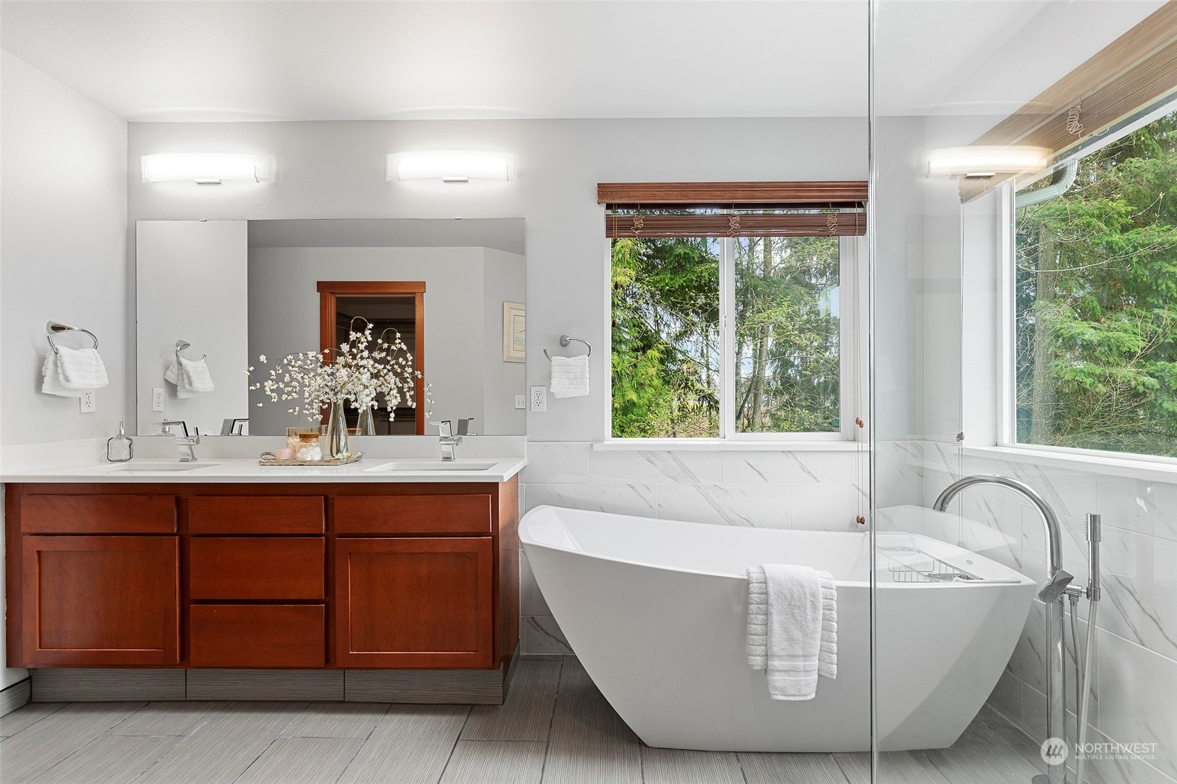4518 147th Place Southeast Bothell, WA 98012 - Photo 25 of 36 a bath tub sitting in a bathroom next to a window