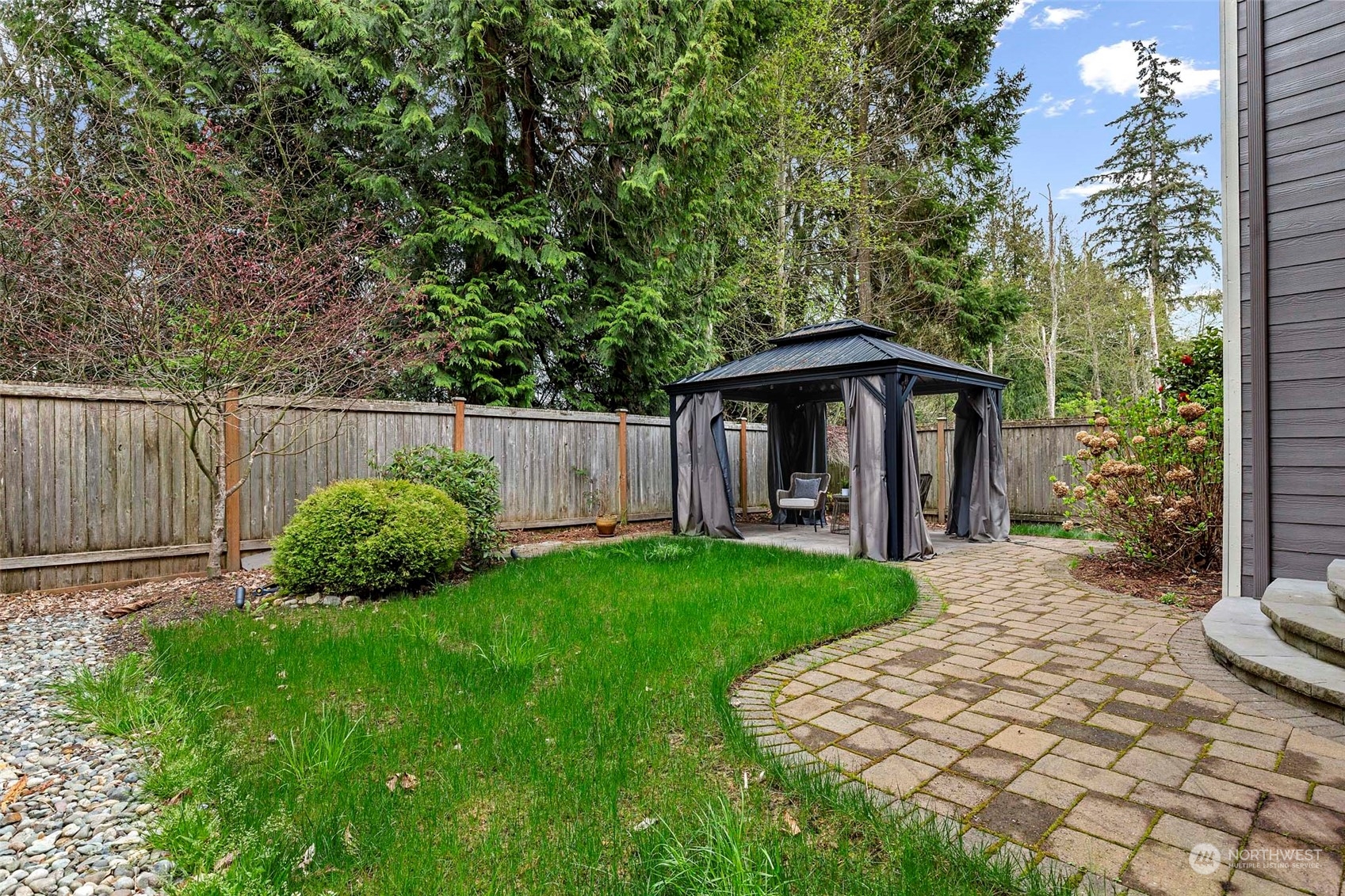 4518 147th Place Southeast Bothell, WA 98012 - Photo 31 of 36 a front view of a house with garden
