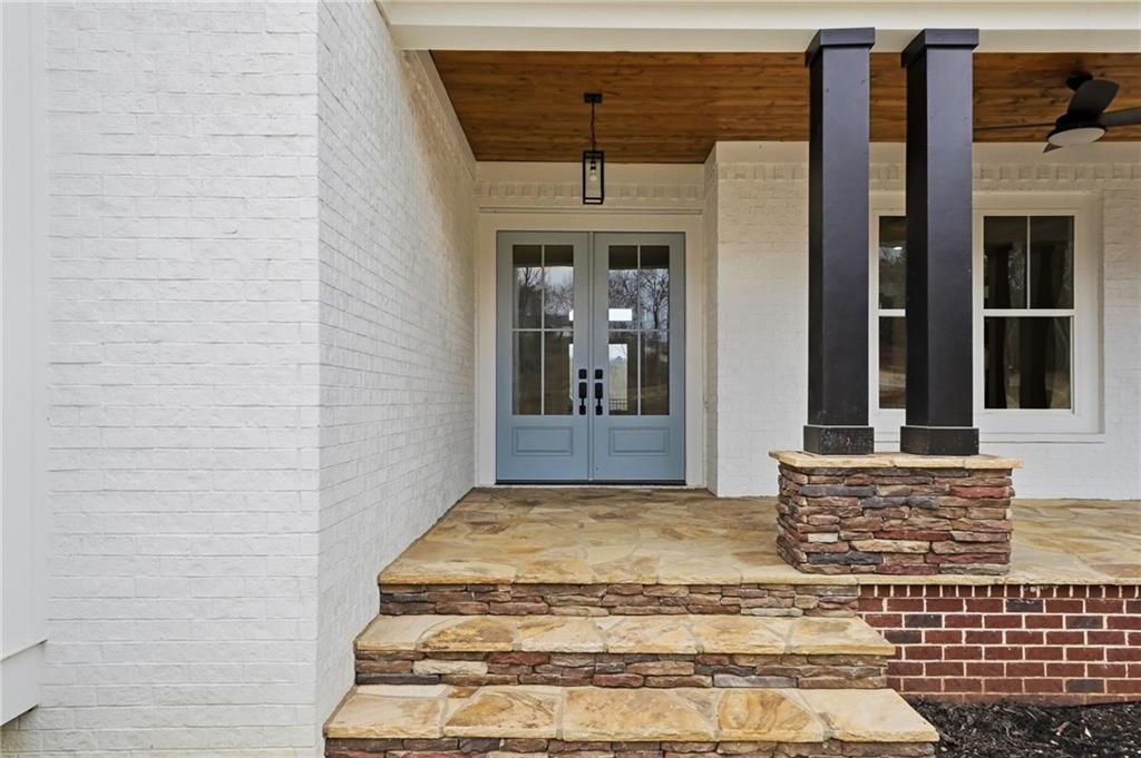 1100 Soap Creek Road Ball Ground, GA 30107 - Photo 16 of 107 a view of a entryway door of the house