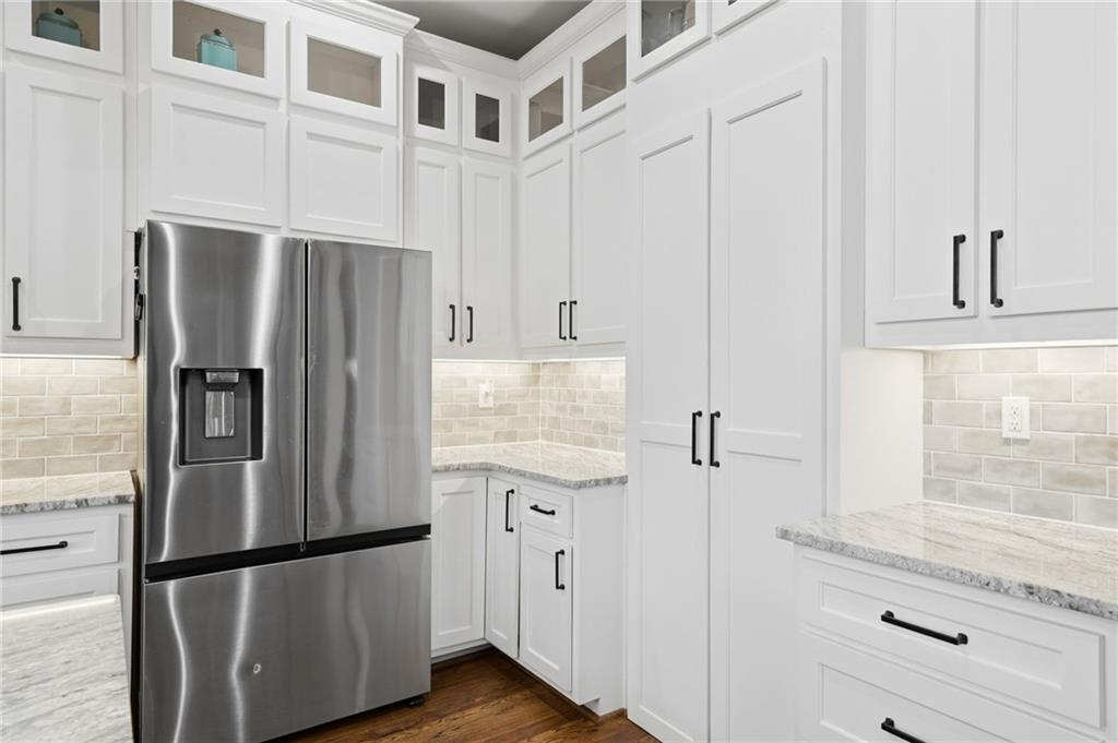 1100 Soap Creek Road Ball Ground, GA 30107 - Photo 29 of 107 a kitchen with stainless steel appliances granite countertop a refrigerator and a stove