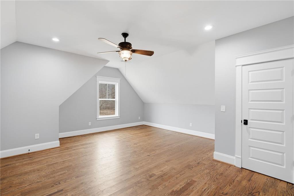 1100 Soap Creek Road Ball Ground, GA 30107 - Photo 46 of 107 a view of an empty room with a window and wooden floor