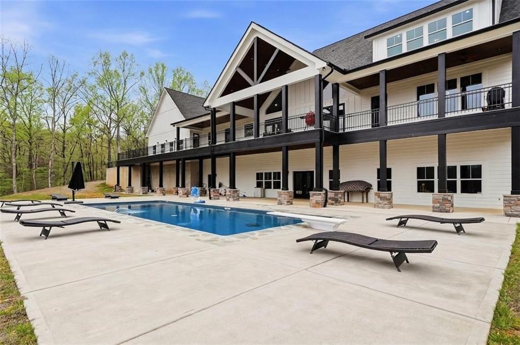 1100 Soap Creek Road Ball Ground, GA 30107 - Photo 62 of 107 a view of a patio with swimming pool table and chairs