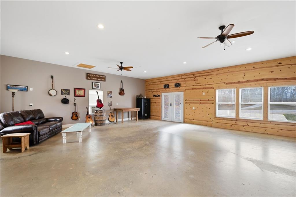 1100 Soap Creek Road Ball Ground, GA 30107 - Photo 82 of 107 a view of a livingroom with furniture and a ceiling fan