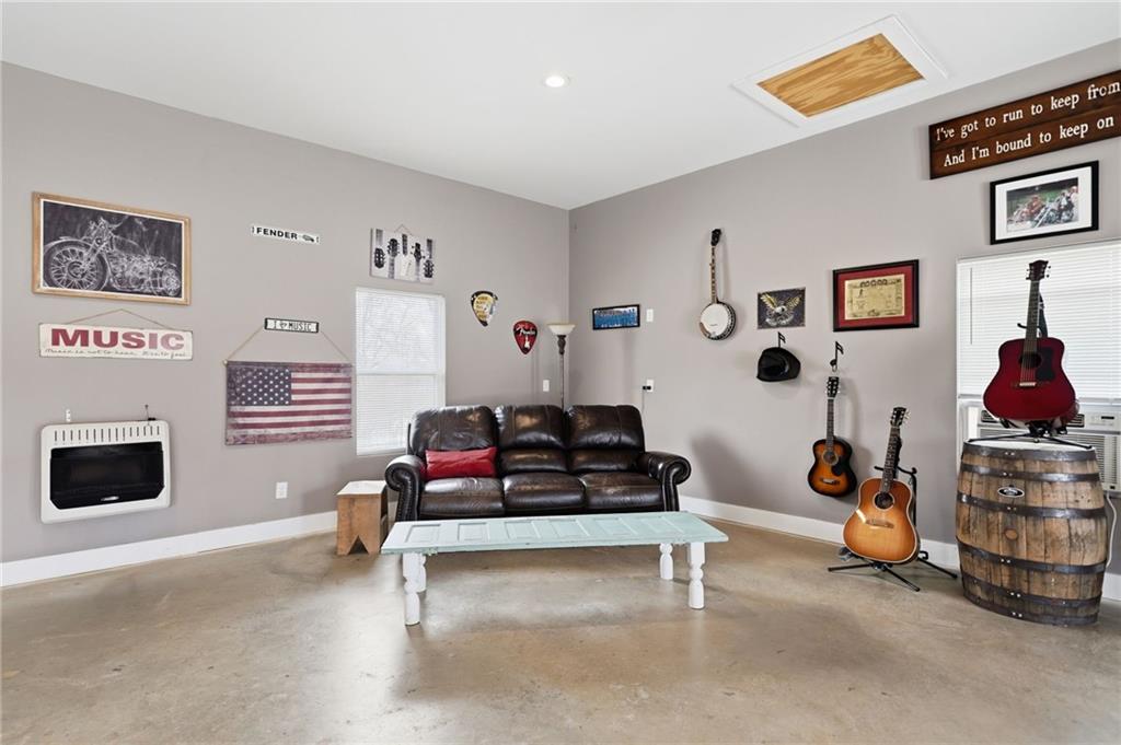 1100 Soap Creek Road Ball Ground, GA 30107 - Photo 85 of 107 a living room with furniture and white walls