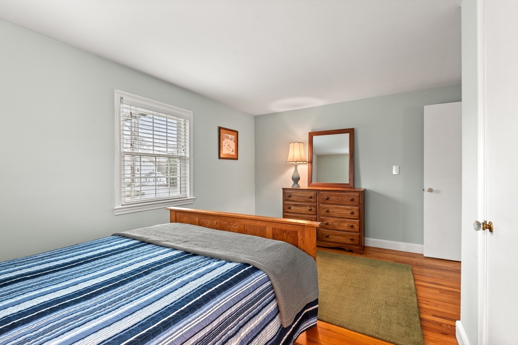 72 Village Street Marblehead, MA 01945 - Photo 11 of 22 a bedroom with a bed and wooden floor
