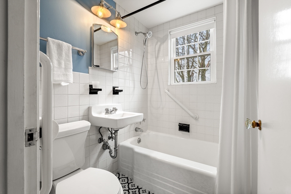 72 Village Street Marblehead, MA 01945 - Photo 14 of 22 a bathroom with a sink a toilet and a bathtub