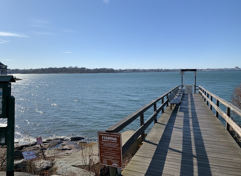 72 Village Street Marblehead, MA 01945 - Photo 20 of 22 a view of a balcony with wooden floor and lake view
