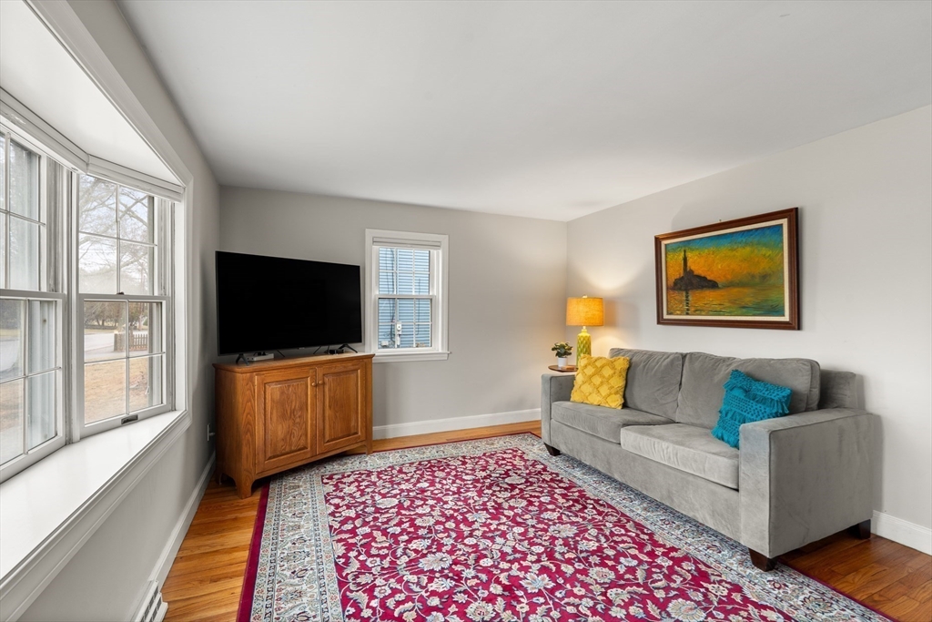 72 Village Street Marblehead, MA 01945 - Photo 4 of 22 a living room with furniture and a flat screen tv