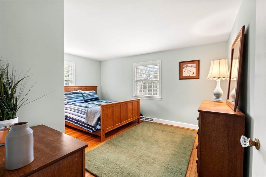 72 Village Street Marblehead, MA 01945 - Photo 9 of 22 a bedroom with furniture and a window
