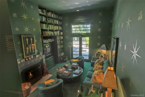 a bedroom with a bed and a chair