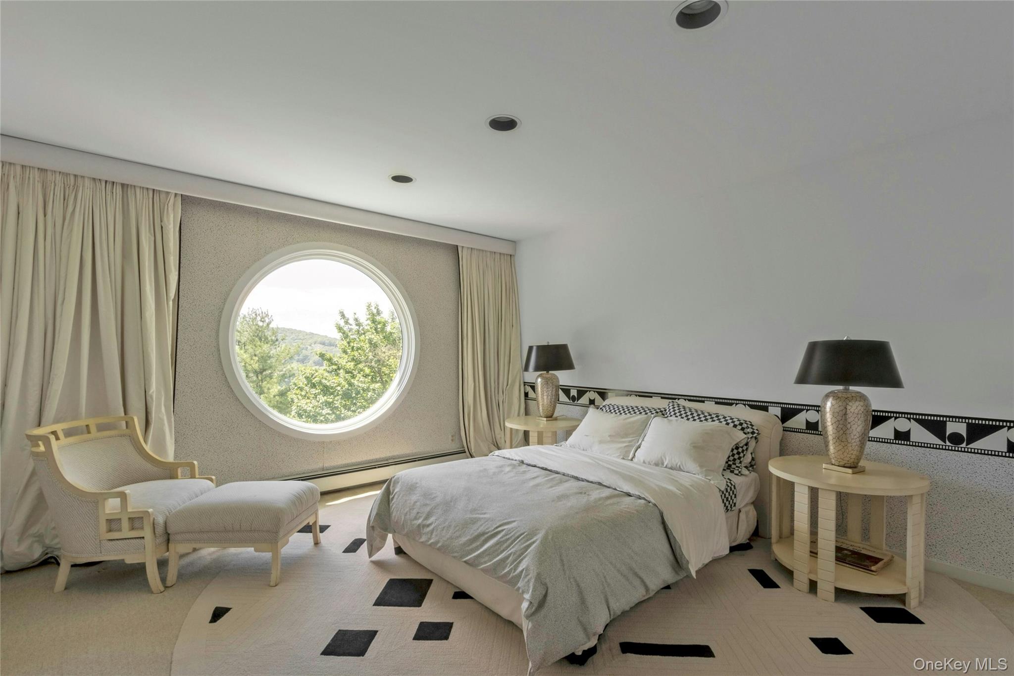 94 Cliff Road Tuxedo Park, NY 10987 - Photo 19 of 37 a bedroom with a bed and a chair