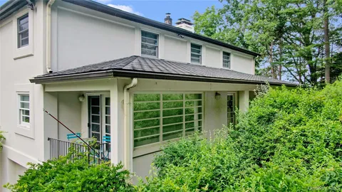 a green field with lots of bushes
