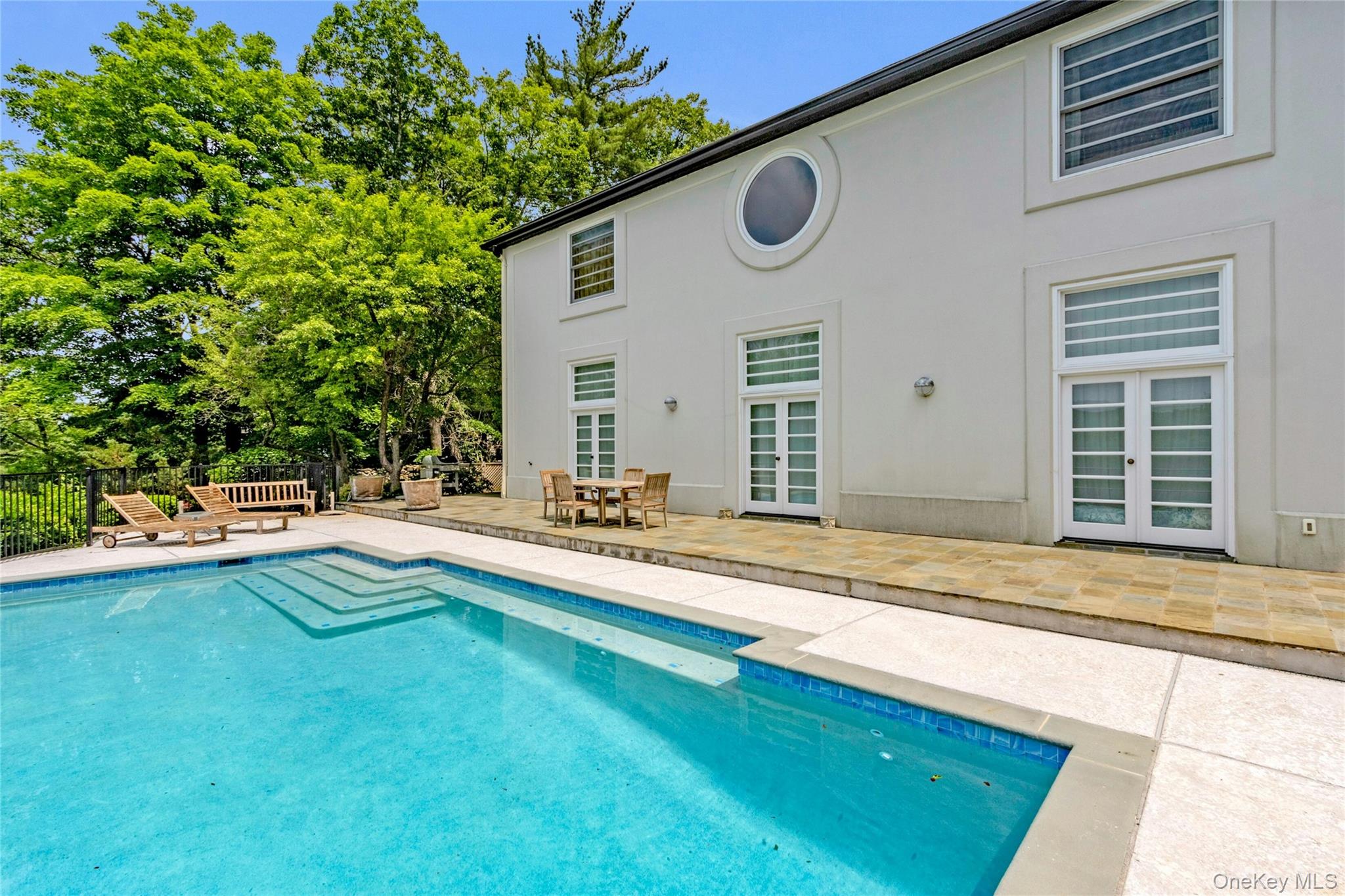 94 Cliff Road Tuxedo Park, NY 10987 - Photo 28 of 37 a view of a house with pool and sitting area