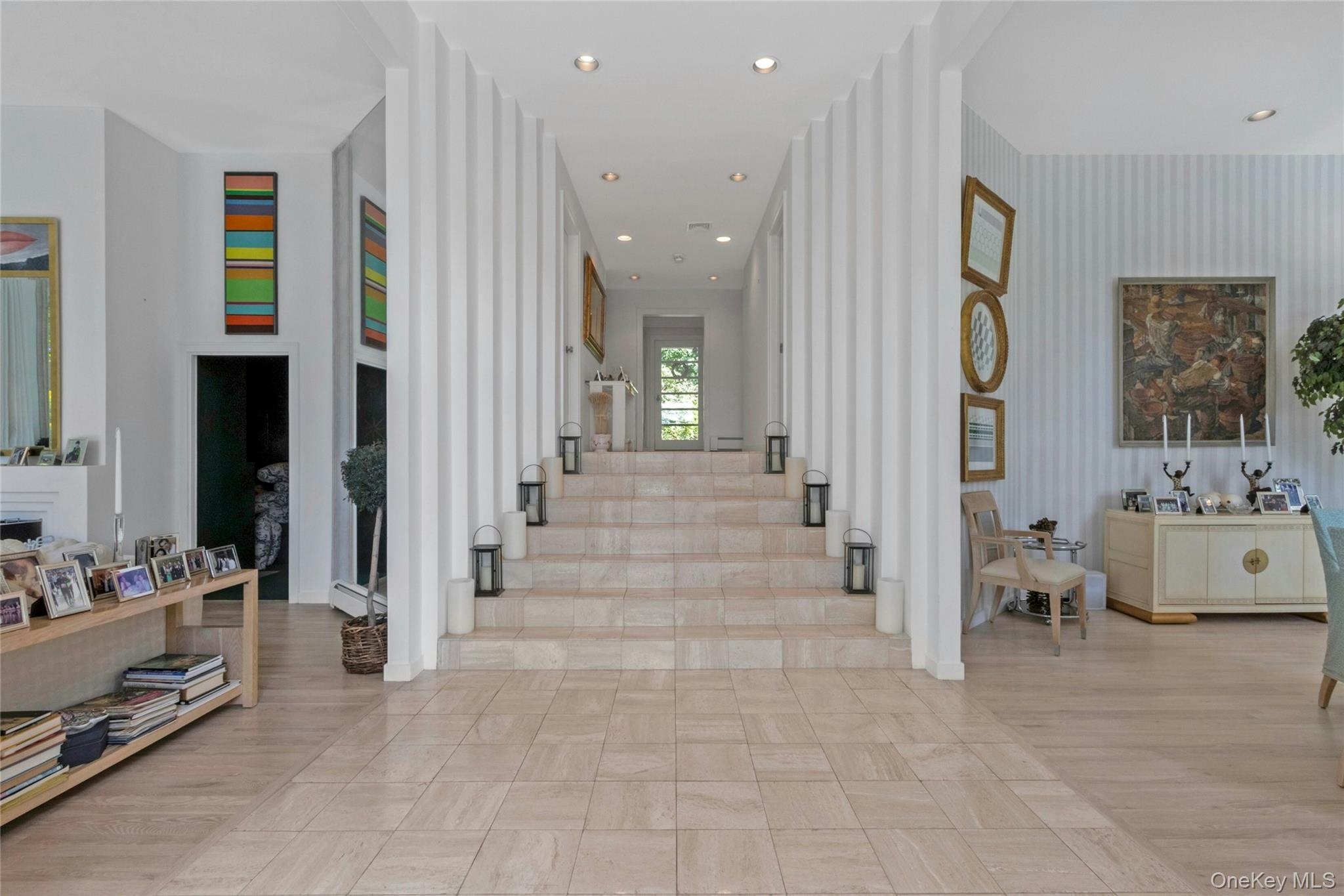 94 Cliff Road Tuxedo Park, NY 10987 - Photo 4 of 37 a view of a hallway with dining area and chandelier