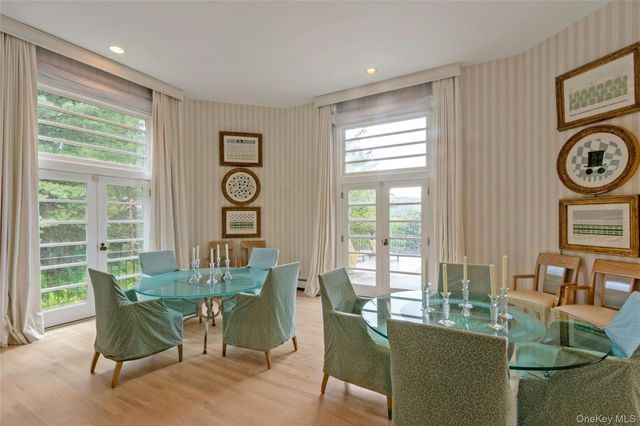 a living room with kitchen island furniture and a large window