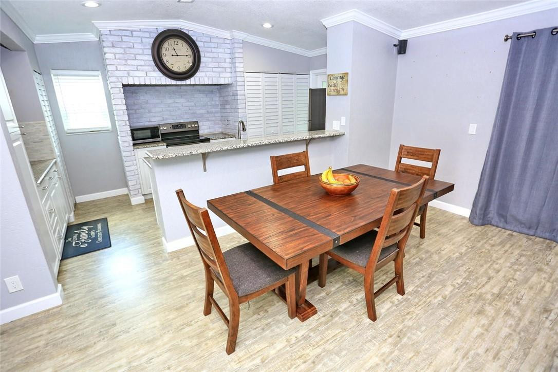 6960 Southwest 1st Street Margate, FL 33068 - Photo 11 of 36 a view of a kitchen with a table and chairs in it