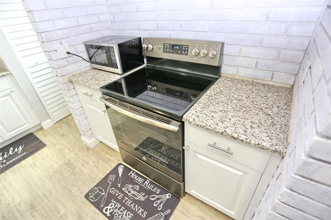6960 Southwest 1st Street Margate, FL 33068 - Photo 16 of 36 a stove top oven sitting inside of a kitchen