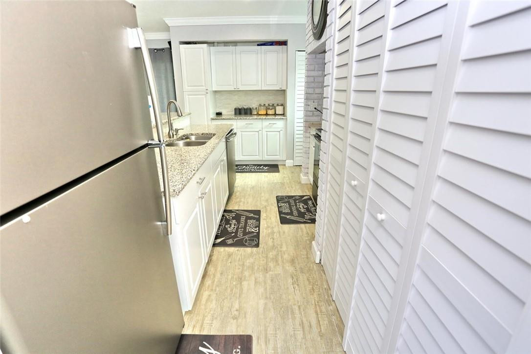 6960 Southwest 1st Street Margate, FL 33068 - Photo 17 of 36 a view of a kitchen from the main door