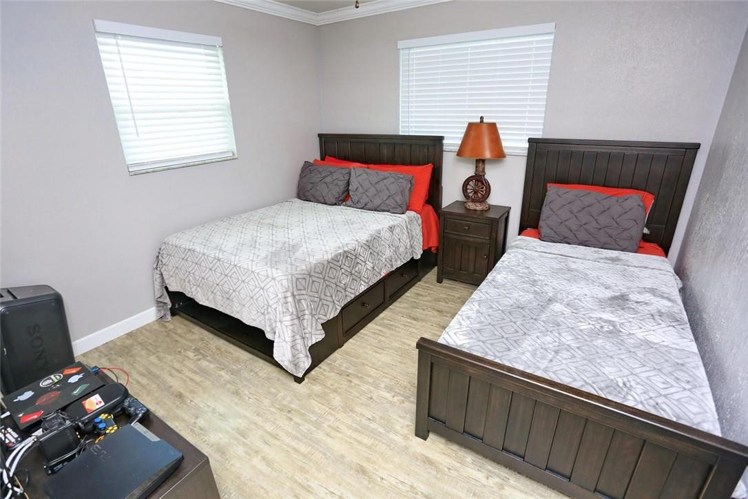 6960 Southwest 1st Street Margate, FL 33068 - Photo 19 of 36 a bedroom with a bed and window