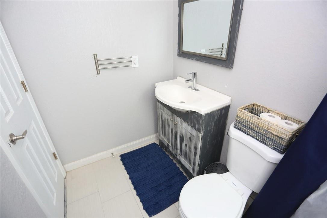 6960 Southwest 1st Street Margate, FL 33068 - Photo 20 of 36 a bathroom with sink and mirror