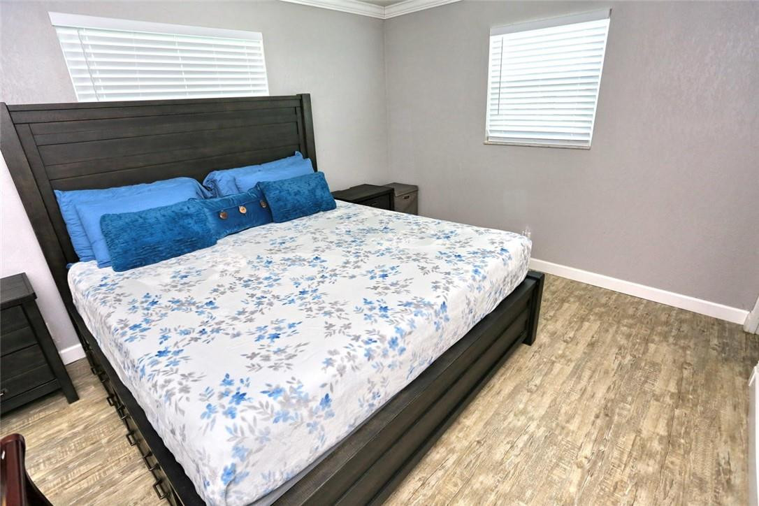 6960 Southwest 1st Street Margate, FL 33068 - Photo 23 of 36 a bed sitting in a bedroom next to a window