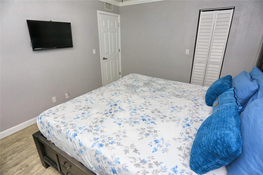 6960 Southwest 1st Street Margate, FL 33068 - Photo 24 of 36 a bedroom with a bed and a flat screen tv