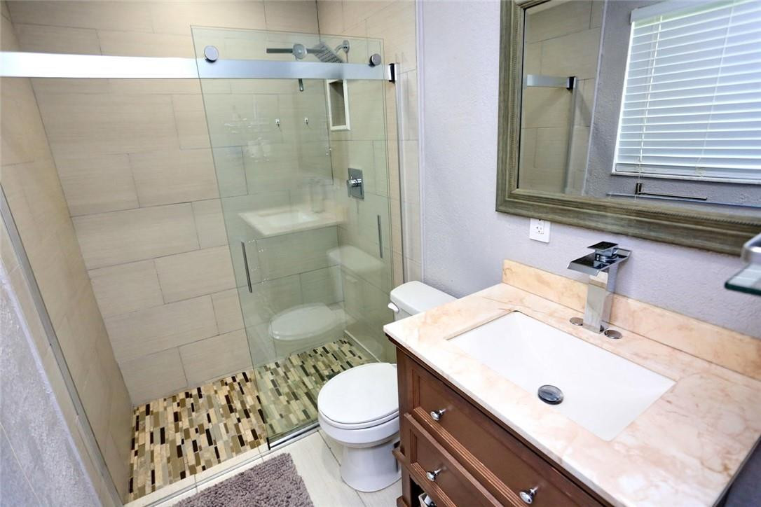 6960 Southwest 1st Street Margate, FL 33068 - Photo 25 of 36 a bathroom with a sink toilet and shower
